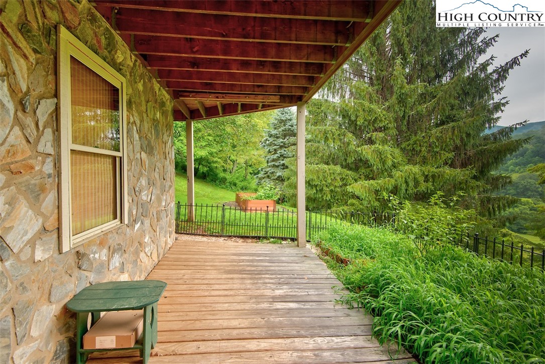 314 Sutherland Road Creston, NC 28615 - Photo 25 of 50 a view of a backyard with garden