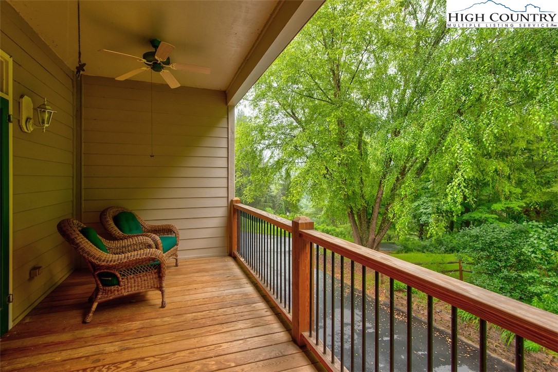 314 Sutherland Road Creston, NC 28615 - Photo 42 of 50 a view of a balcony with wooden floor and outdoor seating