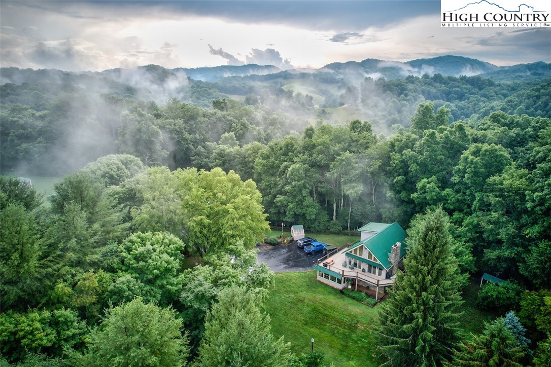 314 Sutherland Road Creston, NC 28615 - Photo 44 of 50 a view of a bench in a field