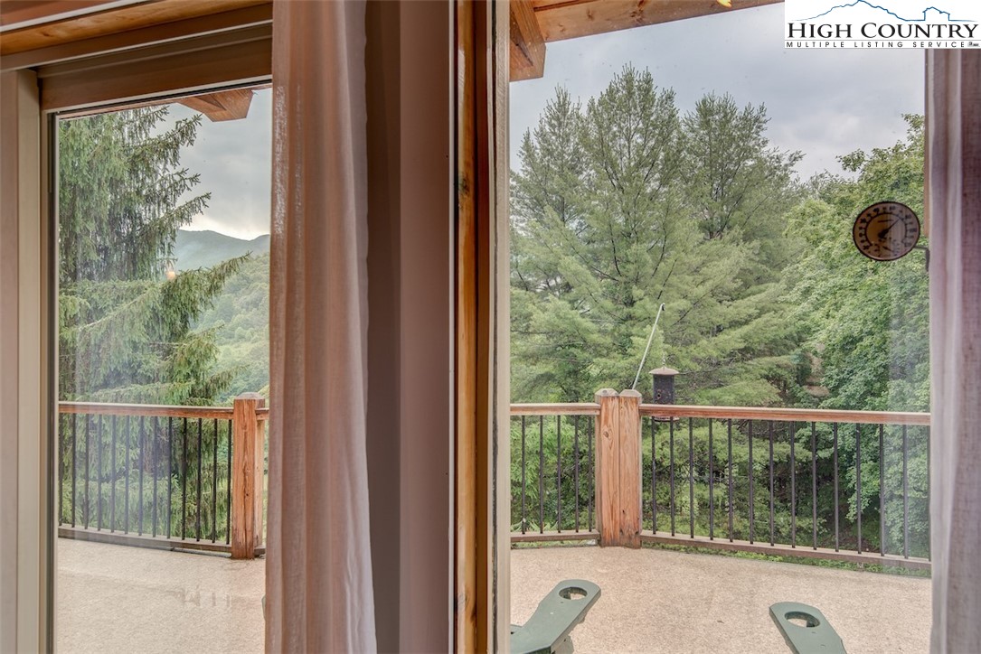 314 Sutherland Road Creston, NC 28615 - Photo 7 of 50 a view of a room and balcony with wooden floor