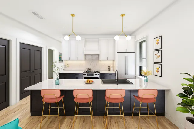 a kitchen that has a table and chairs