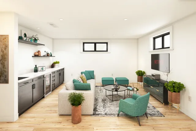 a living room with furniture and a potted plant