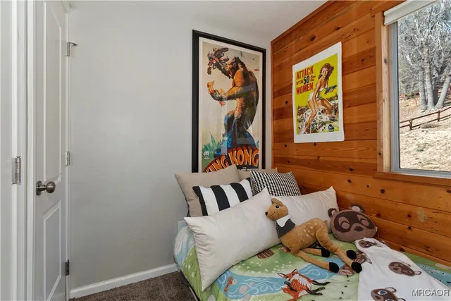 a bedroom with furniture and a window