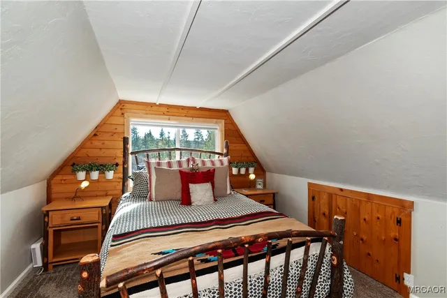 a bedroom with furniture and window