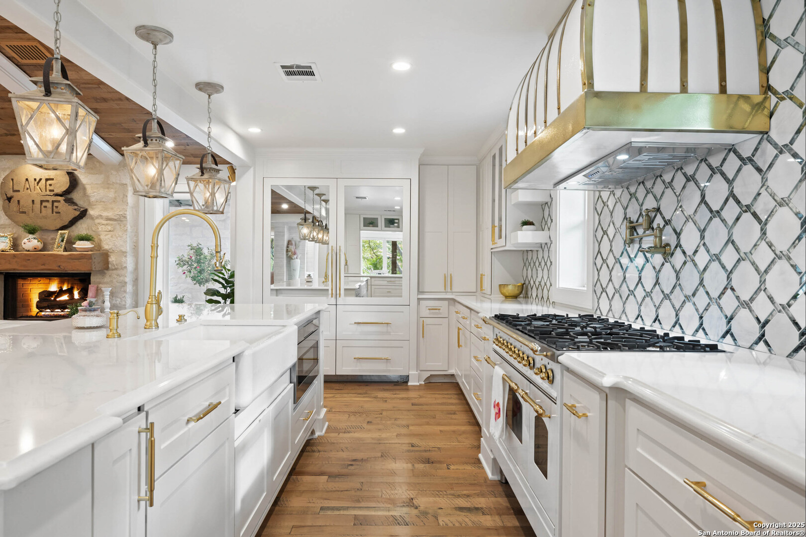 1310 Oak Springs Road Kingsland, TX 78639 - Photo 16 of 49 a kitchen with stainless steel appliances granite countertop a stove and a sink