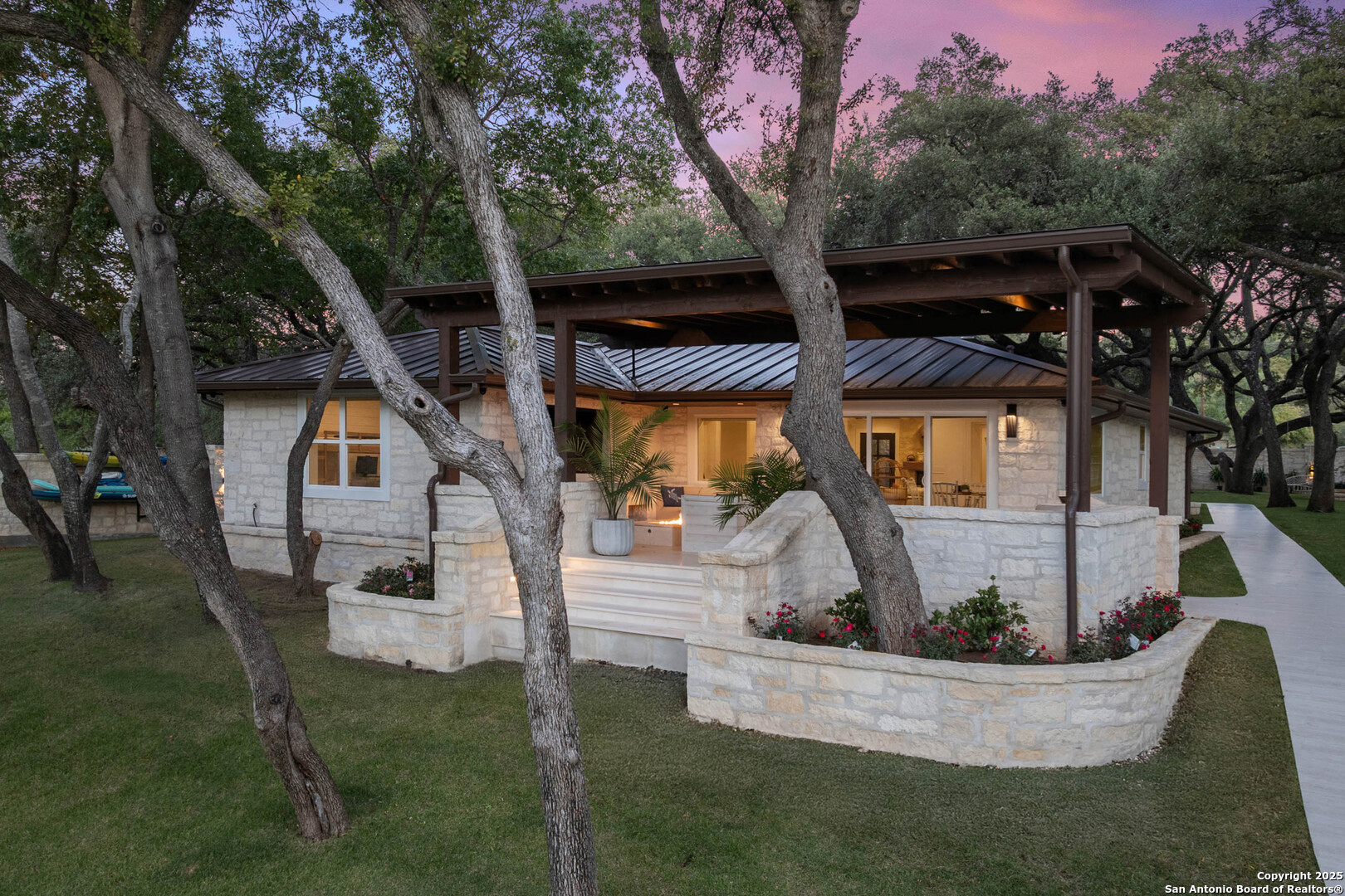 1310 Oak Springs Road Kingsland, TX 78639 - Photo 2 of 49 a front view of a house with garden