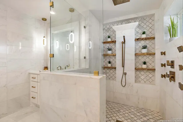 a bathroom with a painting on the wall and a shower curtain