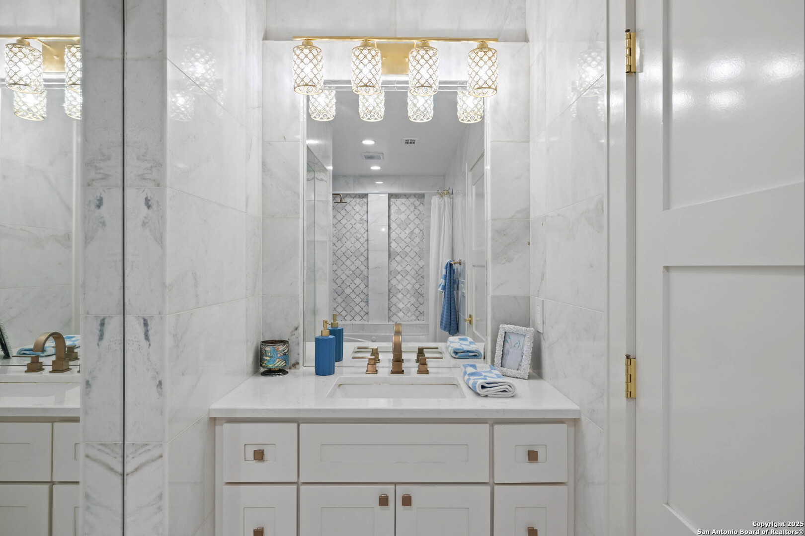 1310 Oak Springs Road Kingsland, TX 78639 - Photo 27 of 49 a bathroom with a sink and a mirror