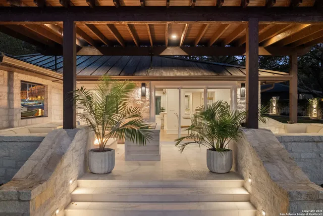 a view of balcony and potted plants