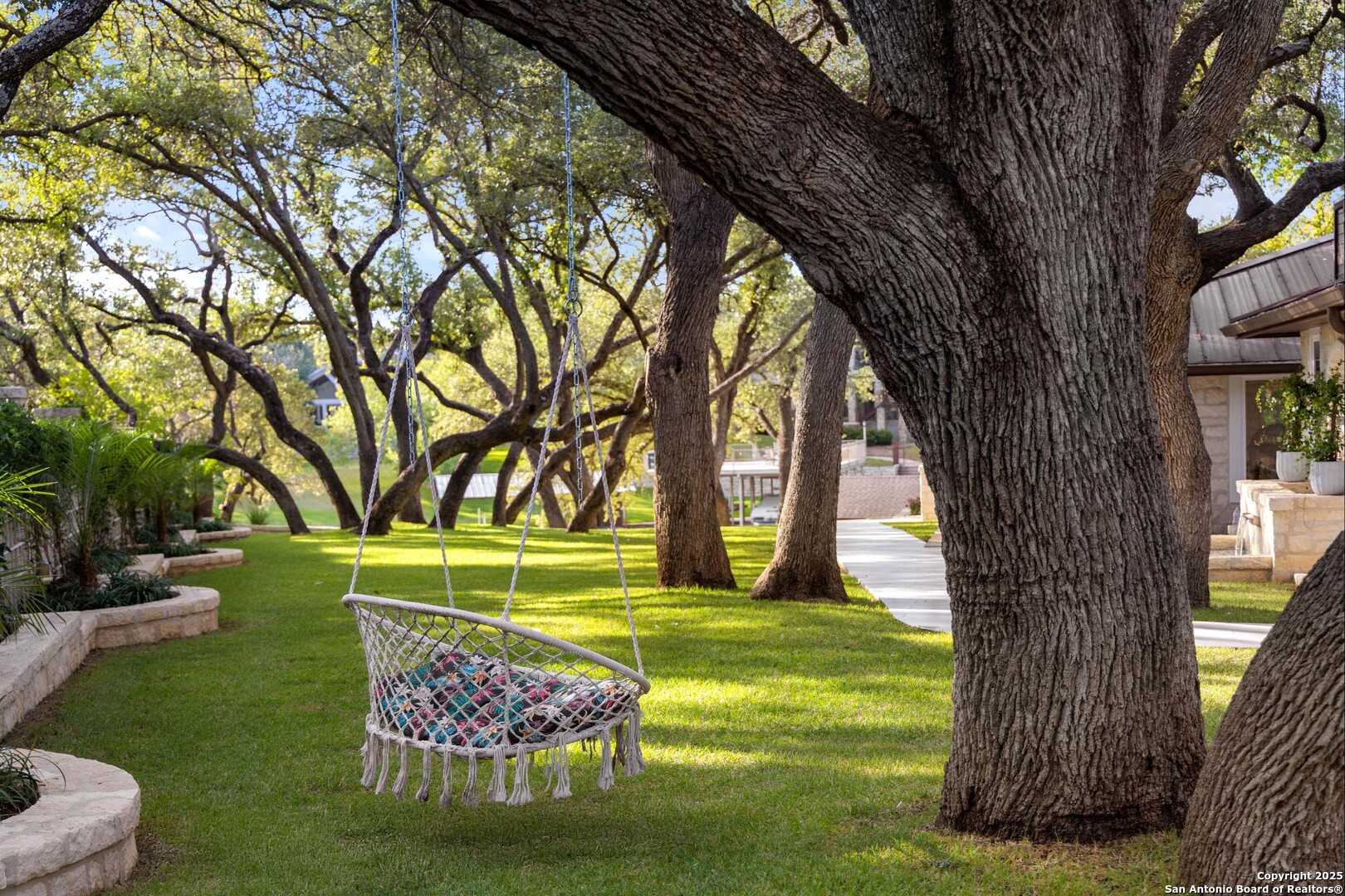1310 Oak Springs Road Kingsland, TX 78639 - Photo 33 of 49 a view of a swimming pool with a garden