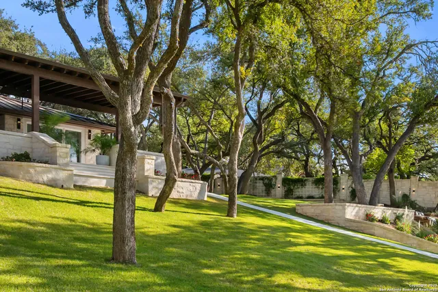 a view of swimming pool with a backyard