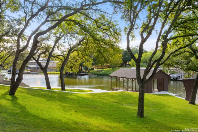 a swimming pool with outdoor seating and yard