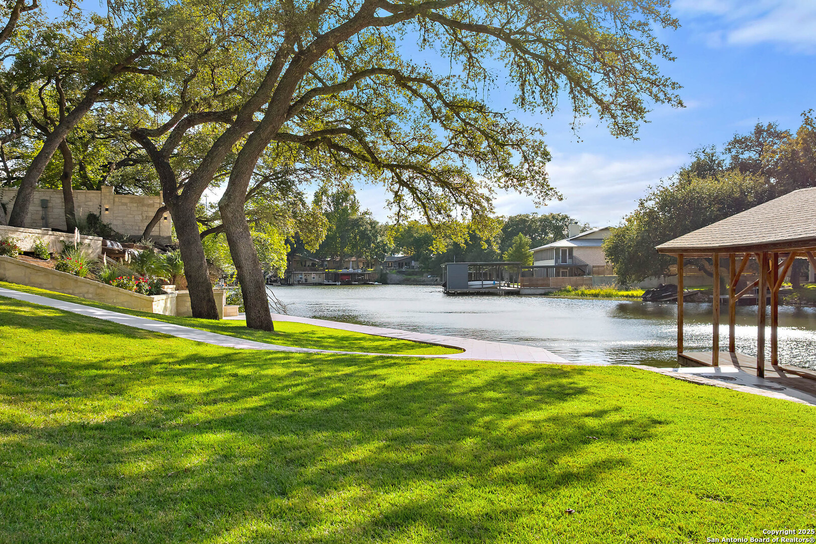 1310 Oak Springs Road Kingsland, TX 78639 - Photo 36 of 49 a swimming pool with outdoor seating and yard