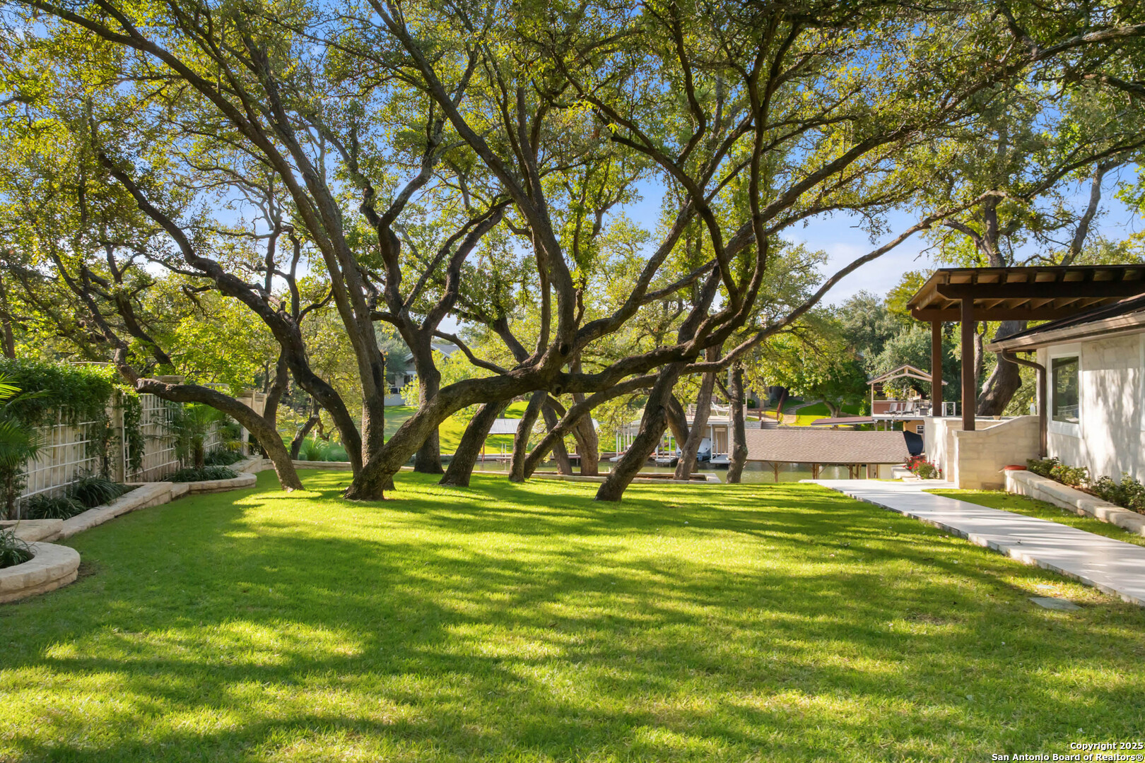 1310 Oak Springs Road Kingsland, TX 78639 - Photo 39 of 49 a swimming pool with outdoor seating and yard