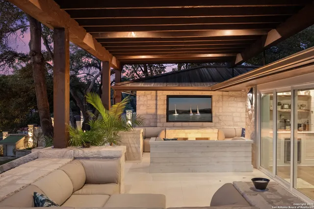 a view of a porch with furniture and a fireplace