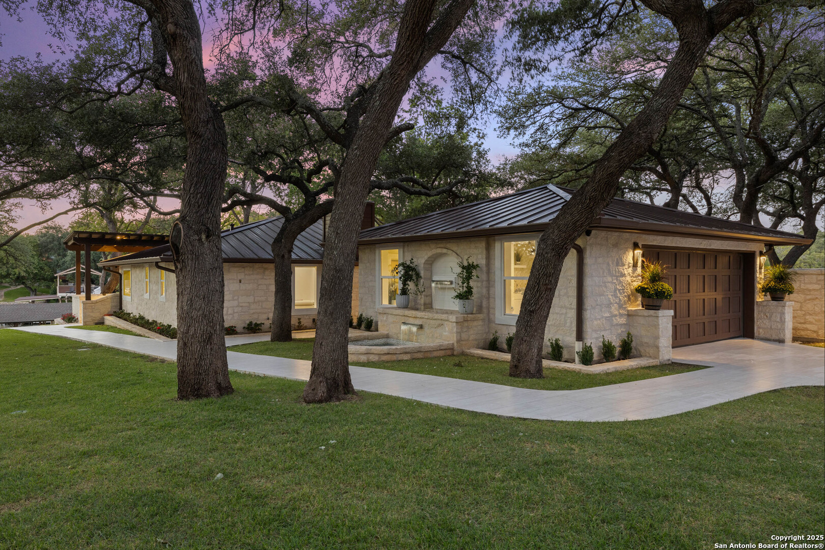 1310 Oak Springs Road Kingsland, TX 78639 - Photo 41 of 49 a front view of a house with garden