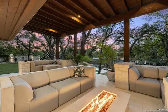an aerial view of a house with outdoor space