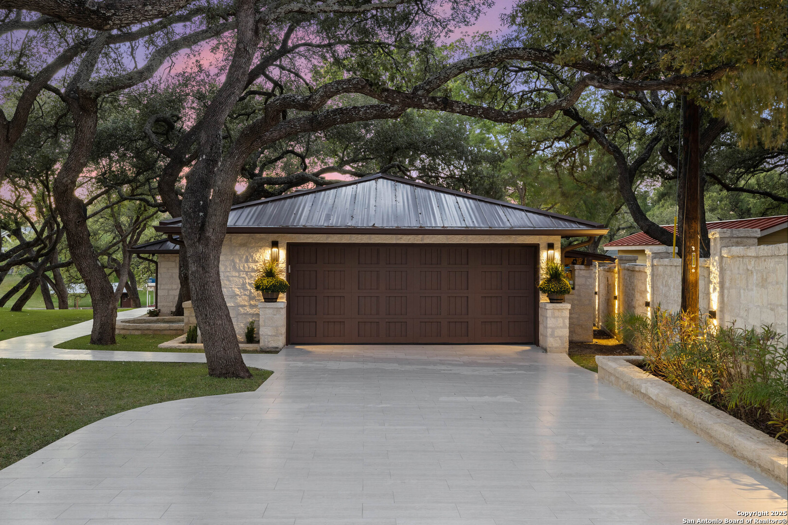 1310 Oak Springs Road Kingsland, TX 78639 - Photo 47 of 49 a view of a house with a tree and wooden fence