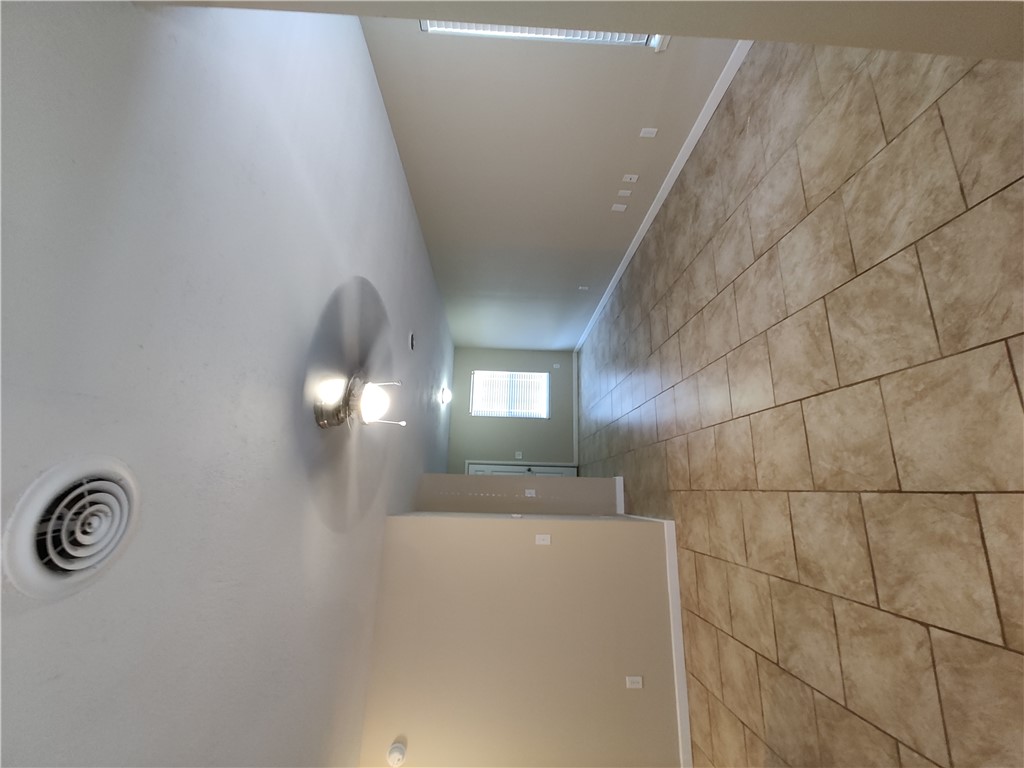 102 Carrigan Road Elkins, AR 72727 - Photo 2 of 9 Tile flooring, ceiling fan with integrated lighting, neutral wall tones, recessed ceiling lighting