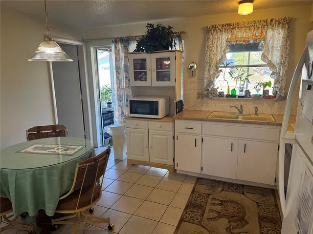 a room with cabinets and chair