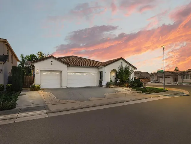 a view of a house with a street