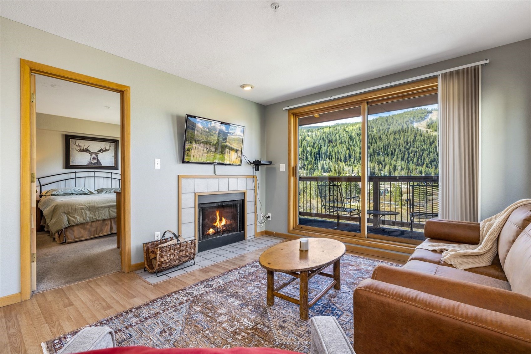 60 Oro Grande Road, Unit 204 Keystone, CO 80435 - Photo 6 of 50 a living room with furniture and a fireplace