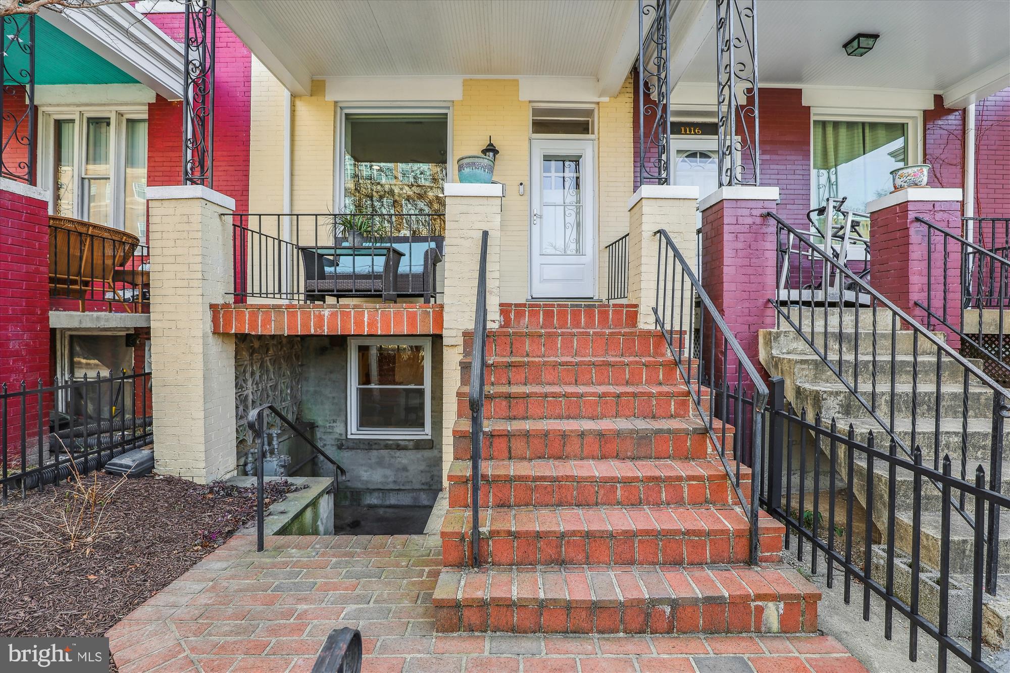1114 Spring Road Northwest Washington, DC 20010 - Photo 141 of 142 a front view of a house with a porch