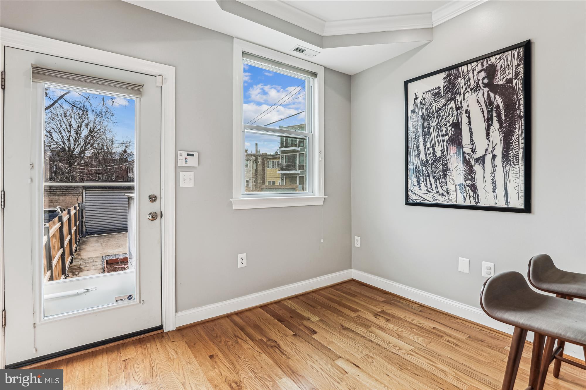 1114 Spring Road Northwest Washington, DC 20010 - Photo 15 of 142 a view of a bedroom with wooden floor and furniture