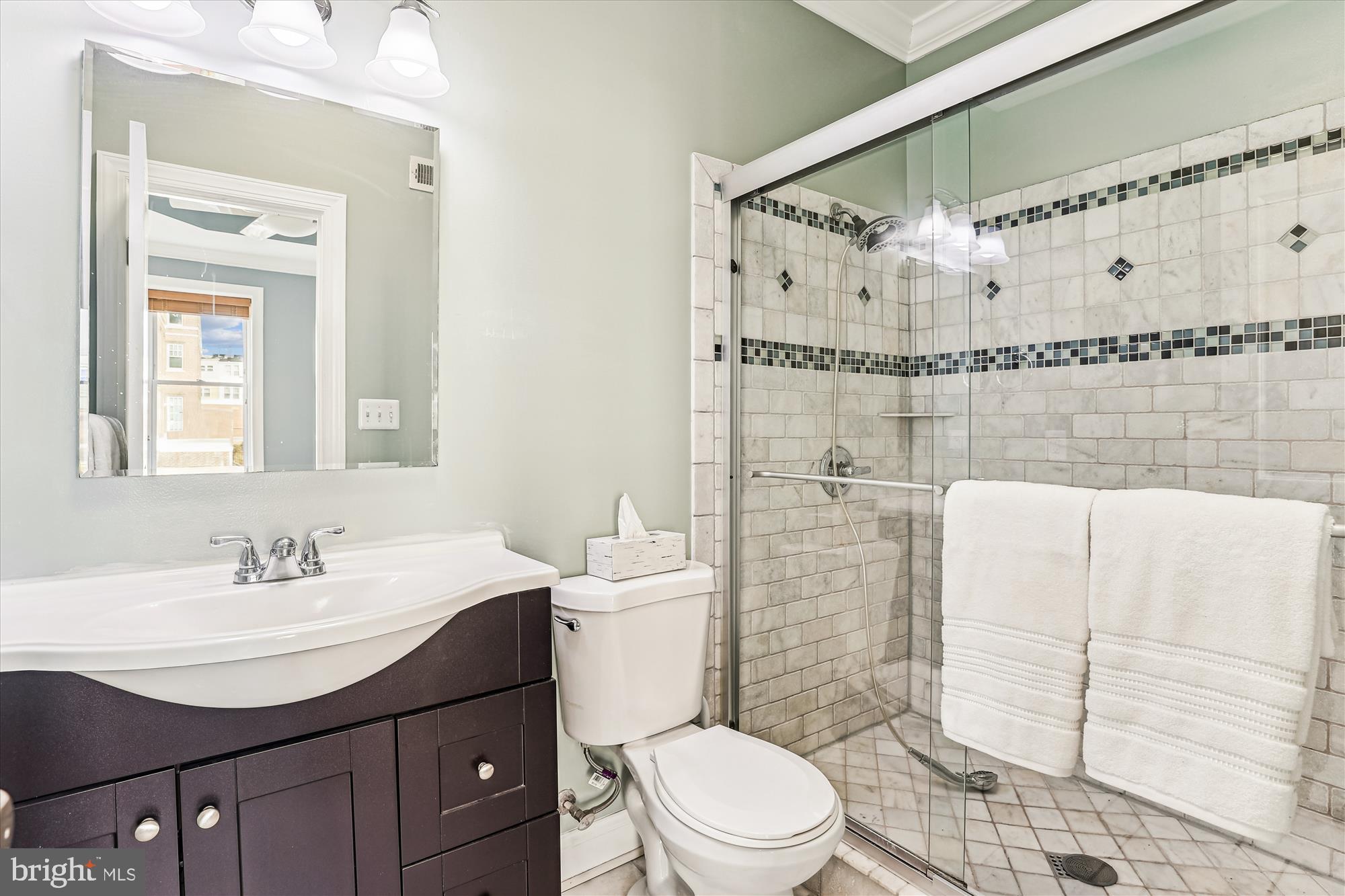 1114 Spring Road Northwest Washington, DC 20010 - Photo 31 of 142 a bathroom with a sink a toilet and shower