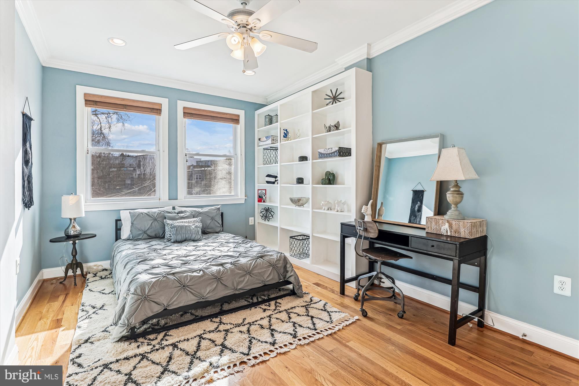 1114 Spring Road Northwest Washington, DC 20010 - Photo 32 of 142 a bedroom with a bed and a window