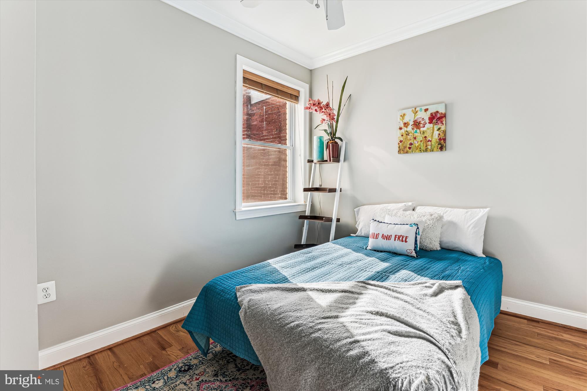 1114 Spring Road Northwest Washington, DC 20010 - Photo 36 of 142 a bedroom with a bed and wooden floor