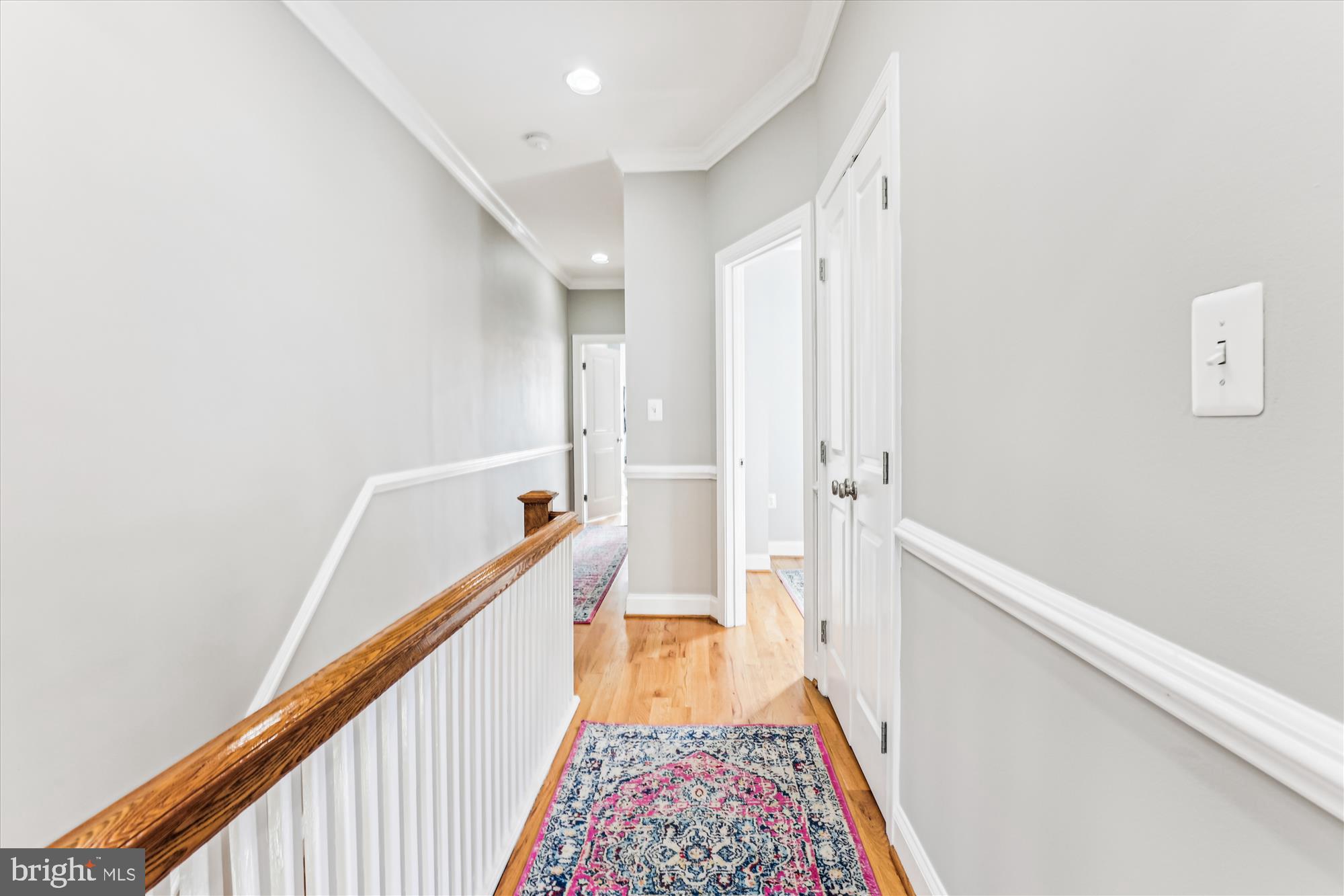 1114 Spring Road Northwest Washington, DC 20010 - Photo 41 of 142 a view of a hallway with wooden floor and staircase