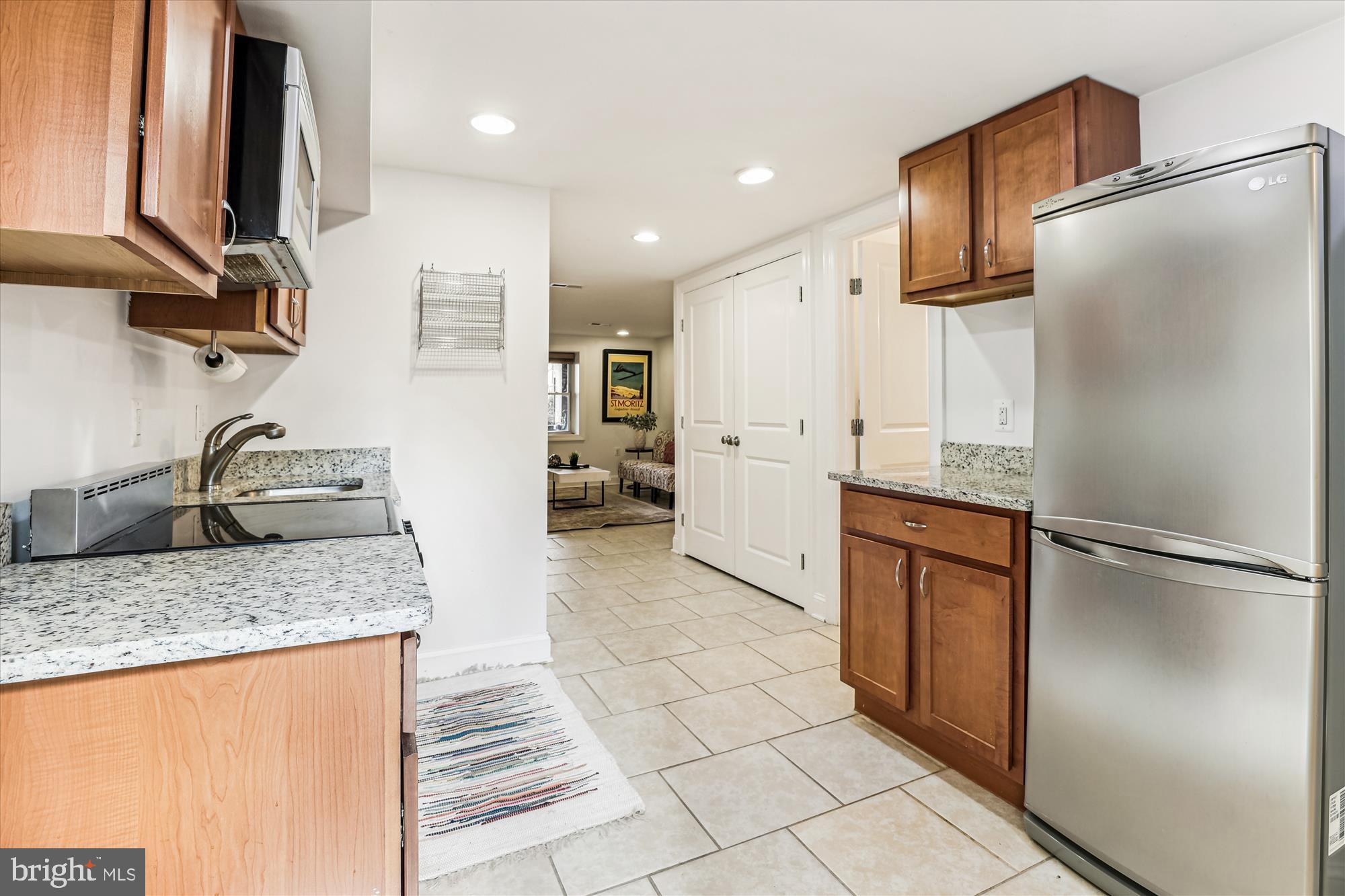 1114 Spring Road Northwest Washington, DC 20010 - Photo 47 of 142 a kitchen with stainless steel appliances granite countertop a refrigerator and a sink