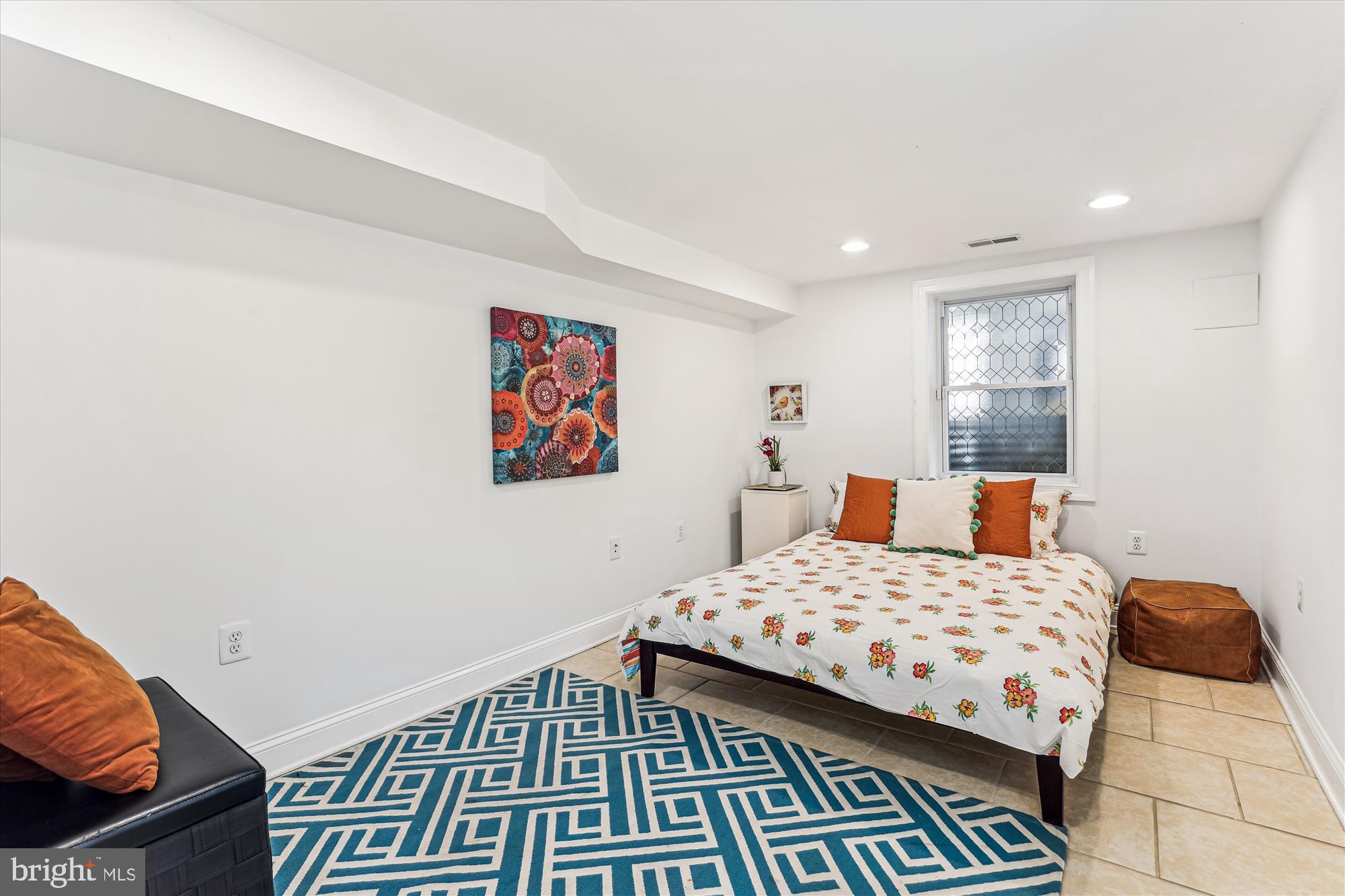 1114 Spring Road Northwest Washington, DC 20010 - Photo 50 of 142 a bedroom with a bed and wooden floor