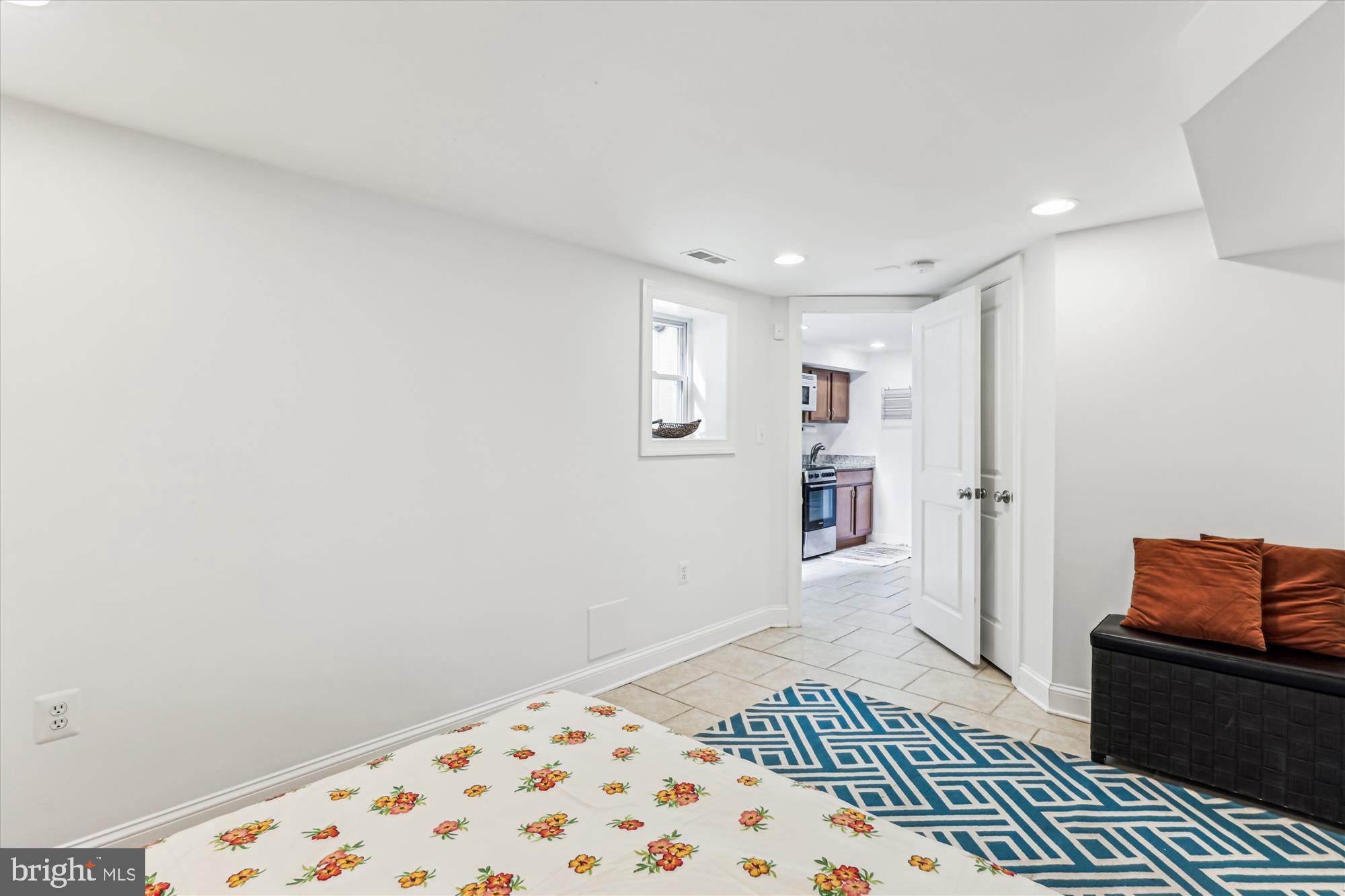 1114 Spring Road Northwest Washington, DC 20010 - Photo 52 of 142 a bedroom with a bed and wooden floor