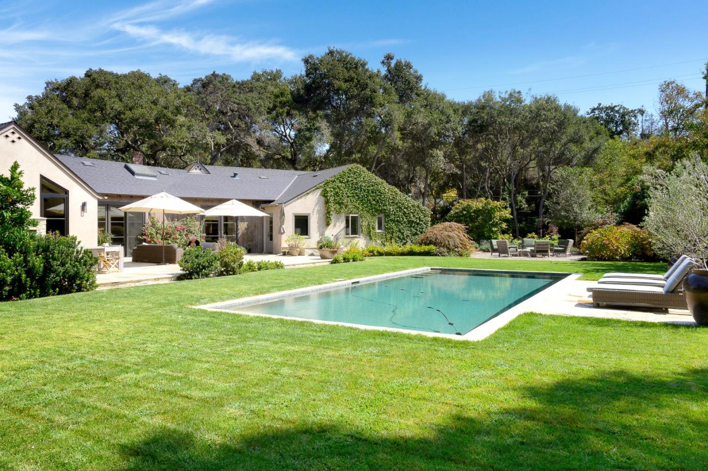 Undisclosed Address Atherton, CA 94027 - Photo 23 of 30 a view of an house with swimming pool and yard