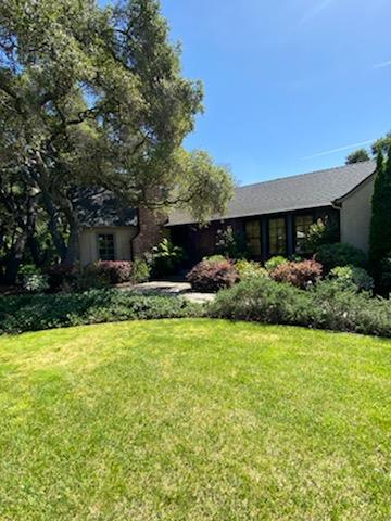 Undisclosed Address Atherton, CA 94027 - Photo 24 of 30 a front view of a house with garden