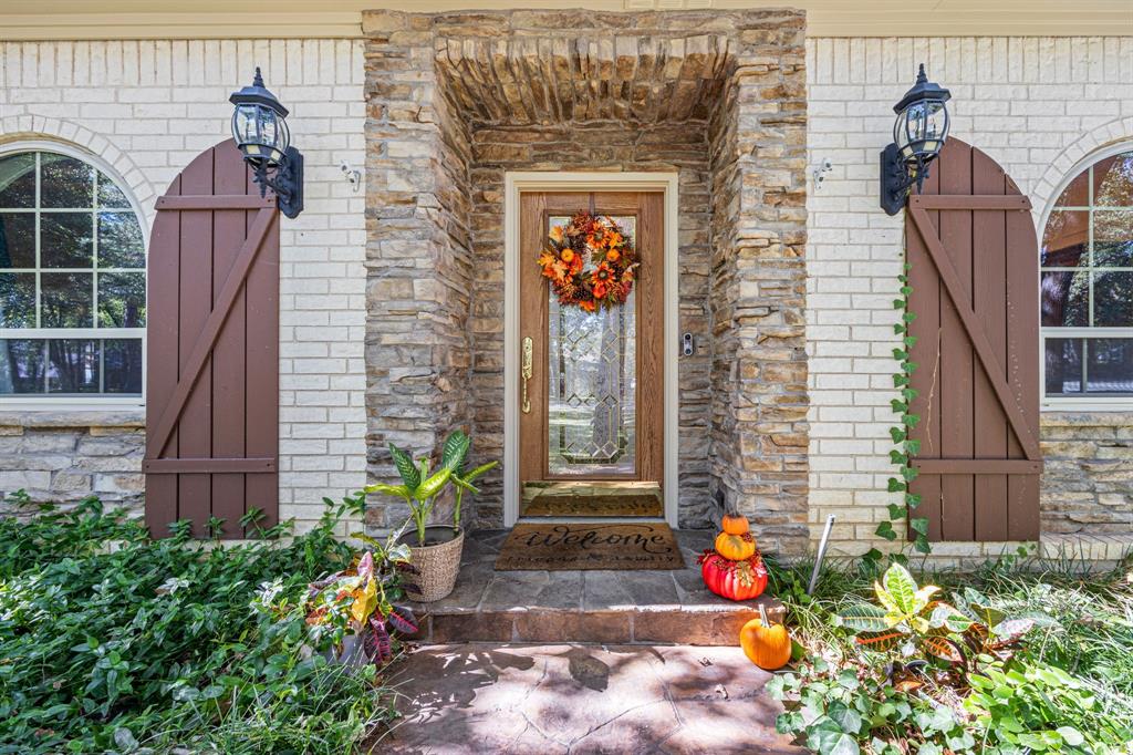 1900 Stonegate Drive Denton, TX 76205 - Photo 1 of 1 a front view of a house with an outdoor space