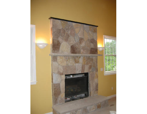 21 Bridge Street Needham, MA 02494 - Photo 6 of 8 a living room with a fireplace