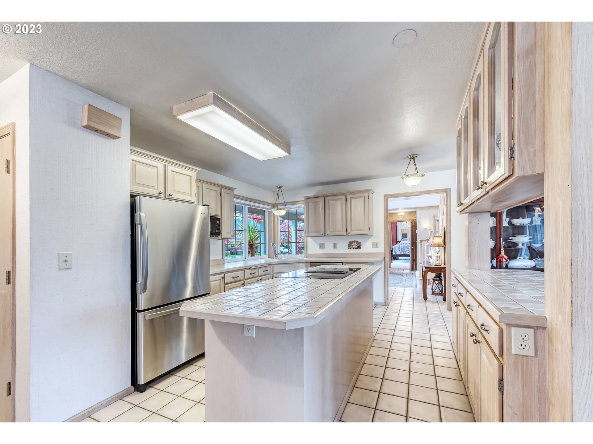 849 Fairway View Drive Eugene, OR 97401 - Photo 15 of 47 a kitchen with stainless steel appliances granite countertop a refrigerator a stove a sink and a refrigerator
