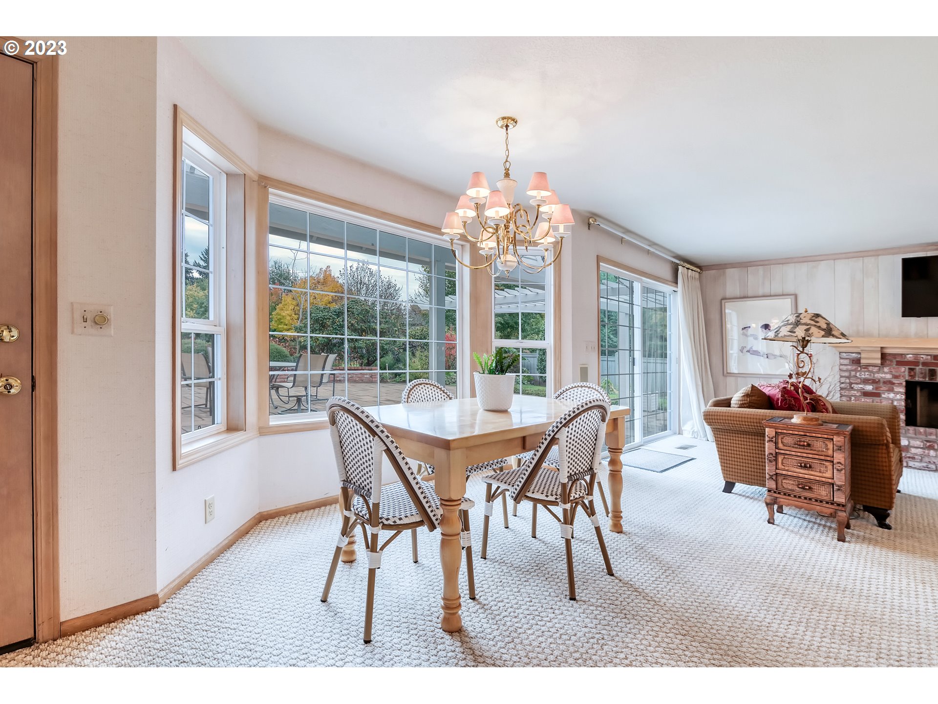 849 Fairway View Drive Eugene, OR 97401 - Photo 17 of 47 a dining room with furniture a chandelier and wooden floor