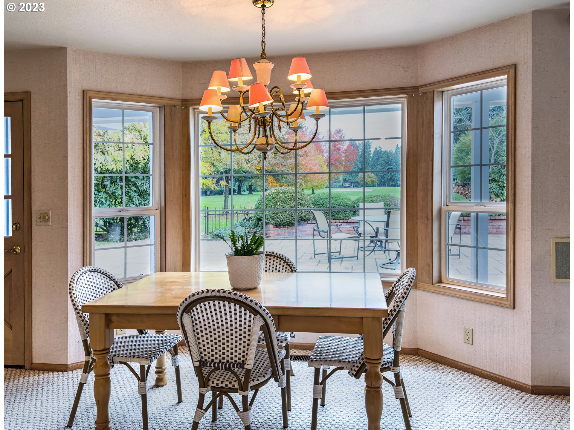 849 Fairway View Drive Eugene, OR 97401 - Photo 18 of 47 a dining room with furniture a chandelier and wooden floor