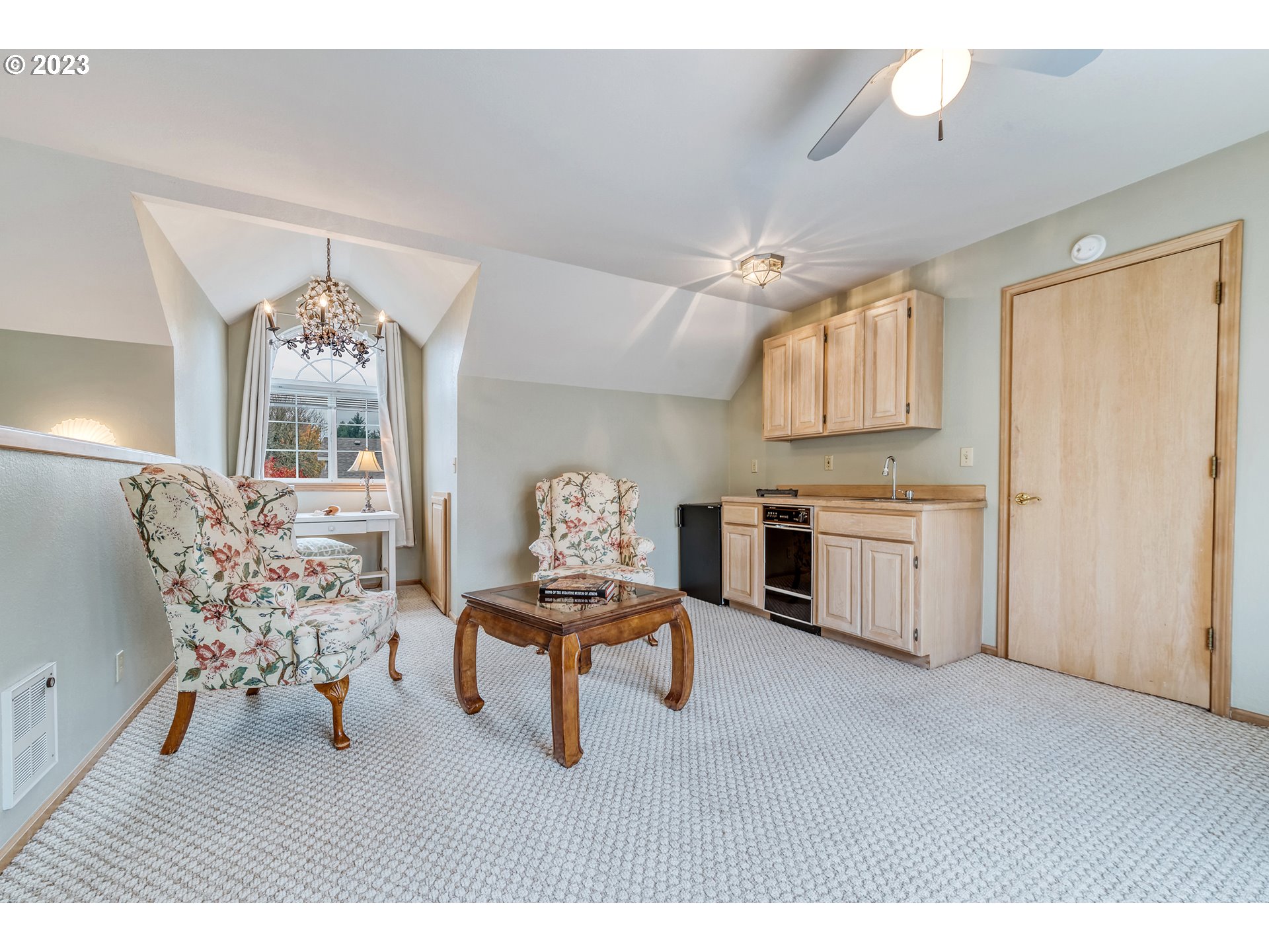849 Fairway View Drive Eugene, OR 97401 - Photo 31 of 47 a living room with furniture and a chandelier