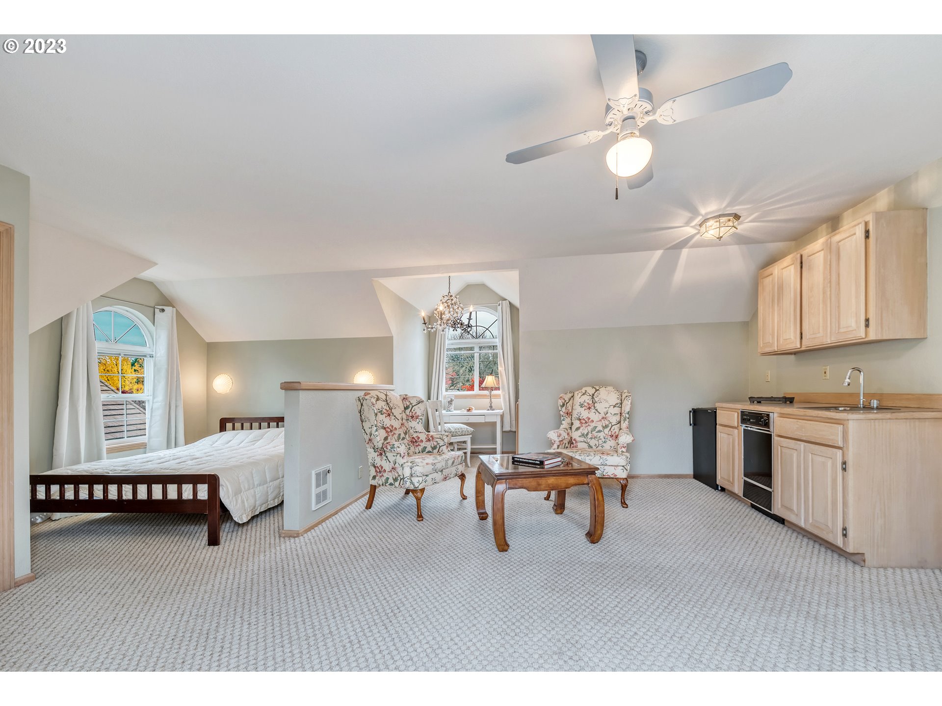 849 Fairway View Drive Eugene, OR 97401 - Photo 32 of 47 a living room with furniture a chandelier and kitchen view