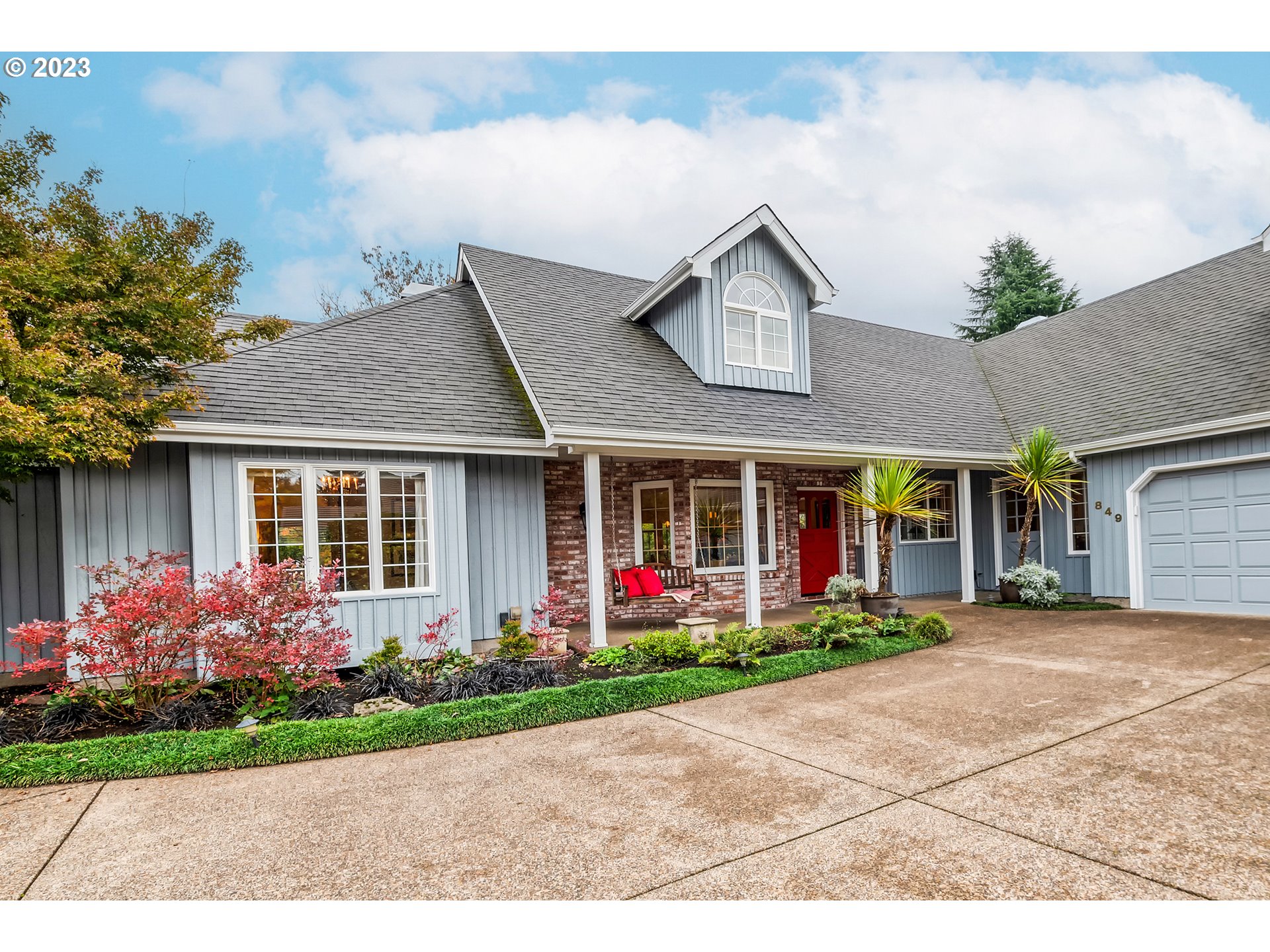 849 Fairway View Drive Eugene, OR 97401 - Photo 5 of 47 a front view of a house with an outdoor garage