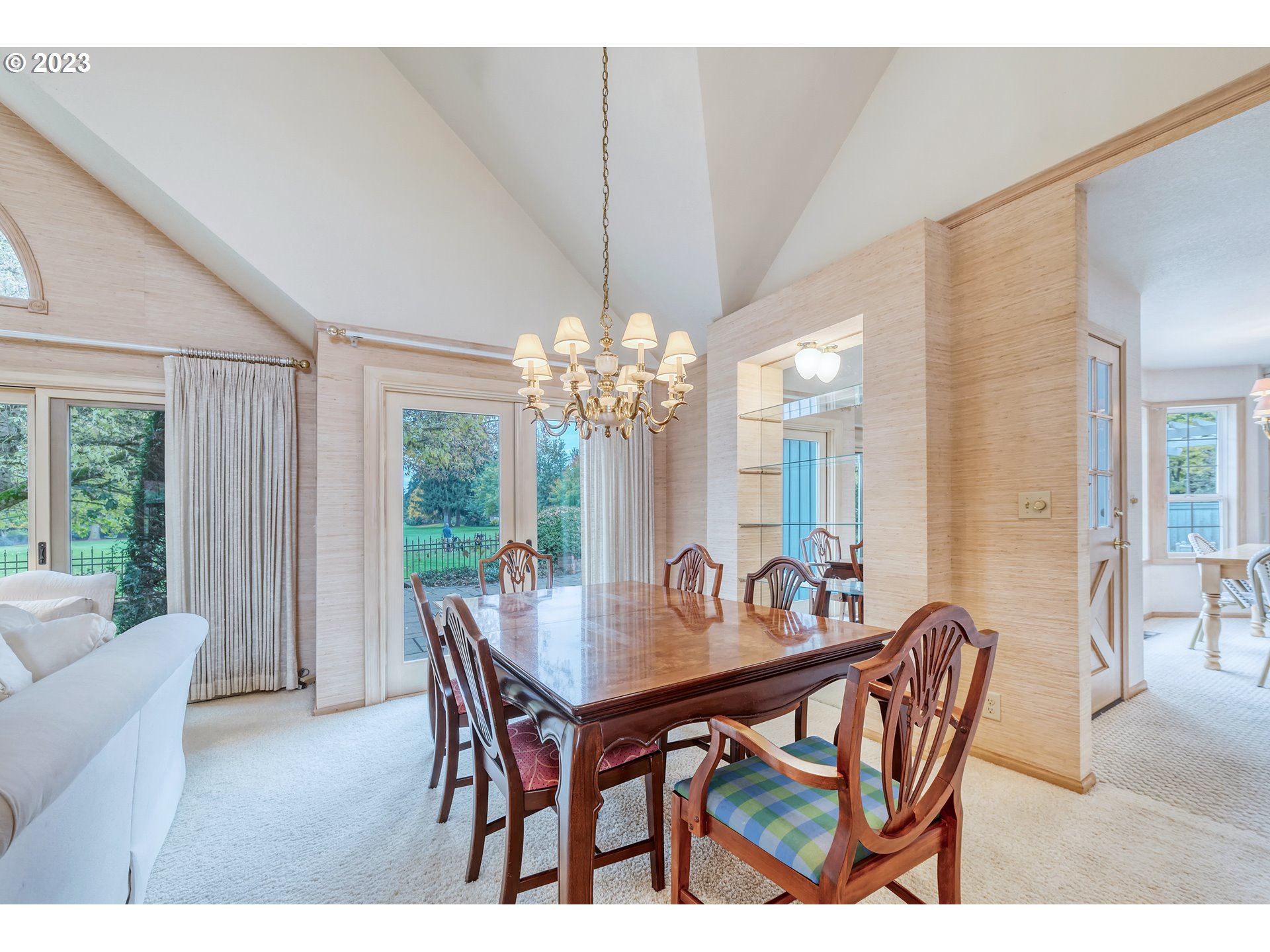 849 Fairway View Drive Eugene, OR 97401 - Photo 10 of 47 a dining room with furniture a chandelier and wooden floor