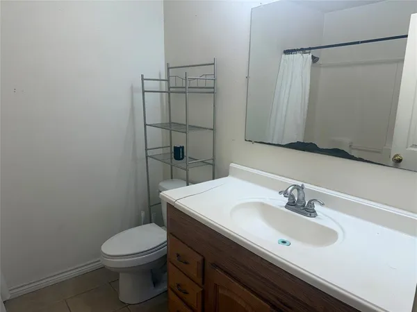a bathroom with a sink toilet and vanity