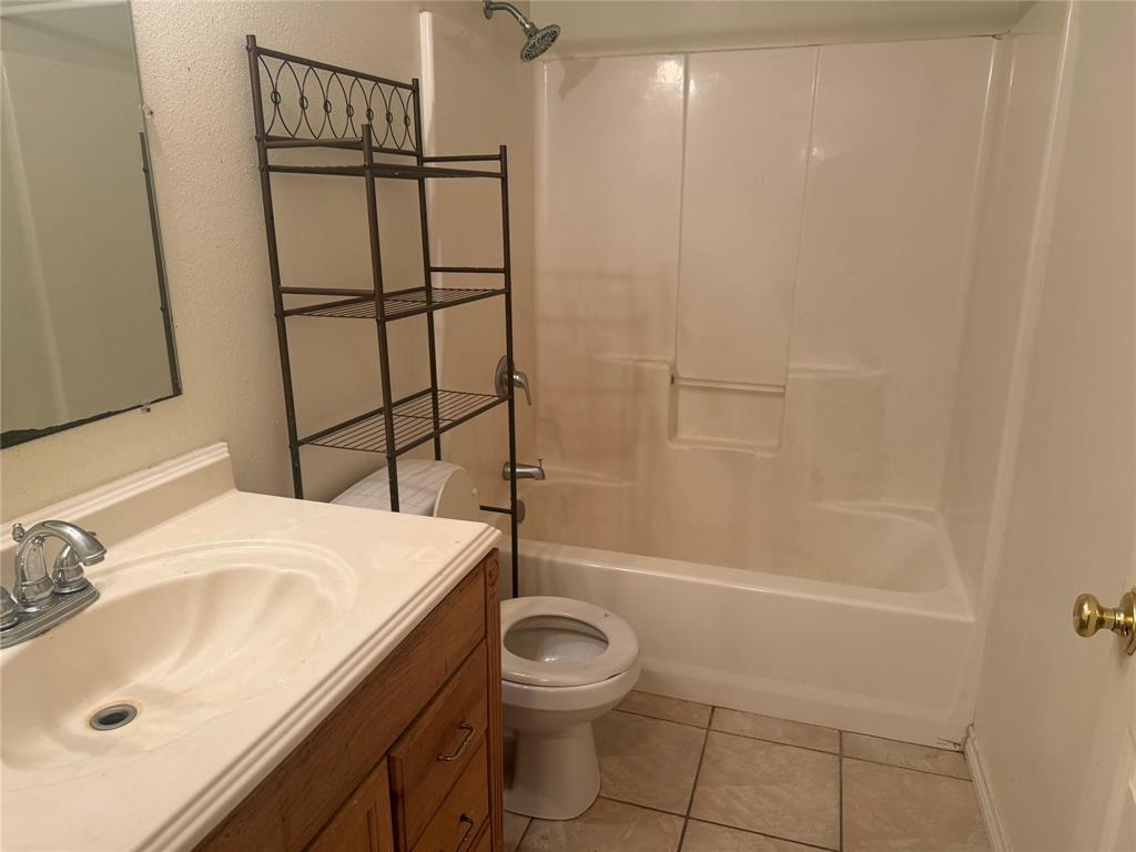 2502 Davisville Road Lufkin, TX 75901 - Photo 22 of 30 a bathroom with a sink toilet and shower