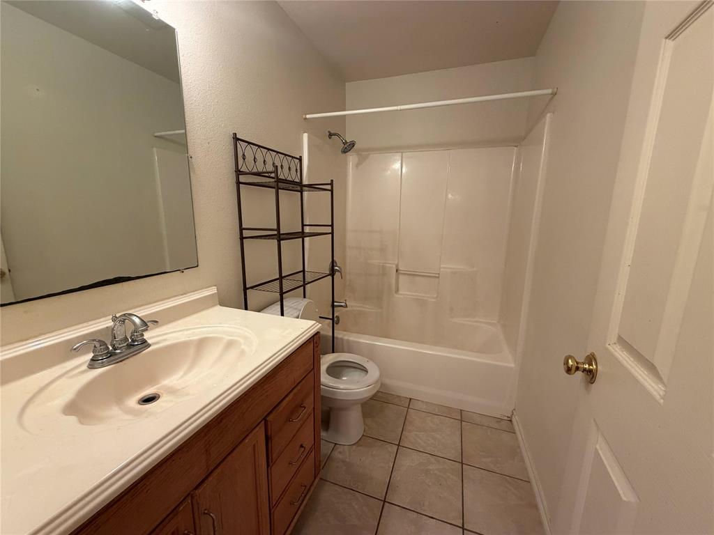 2502 Davisville Road Lufkin, TX 75901 - Photo 23 of 30 a bathroom with a sink toilet and shower