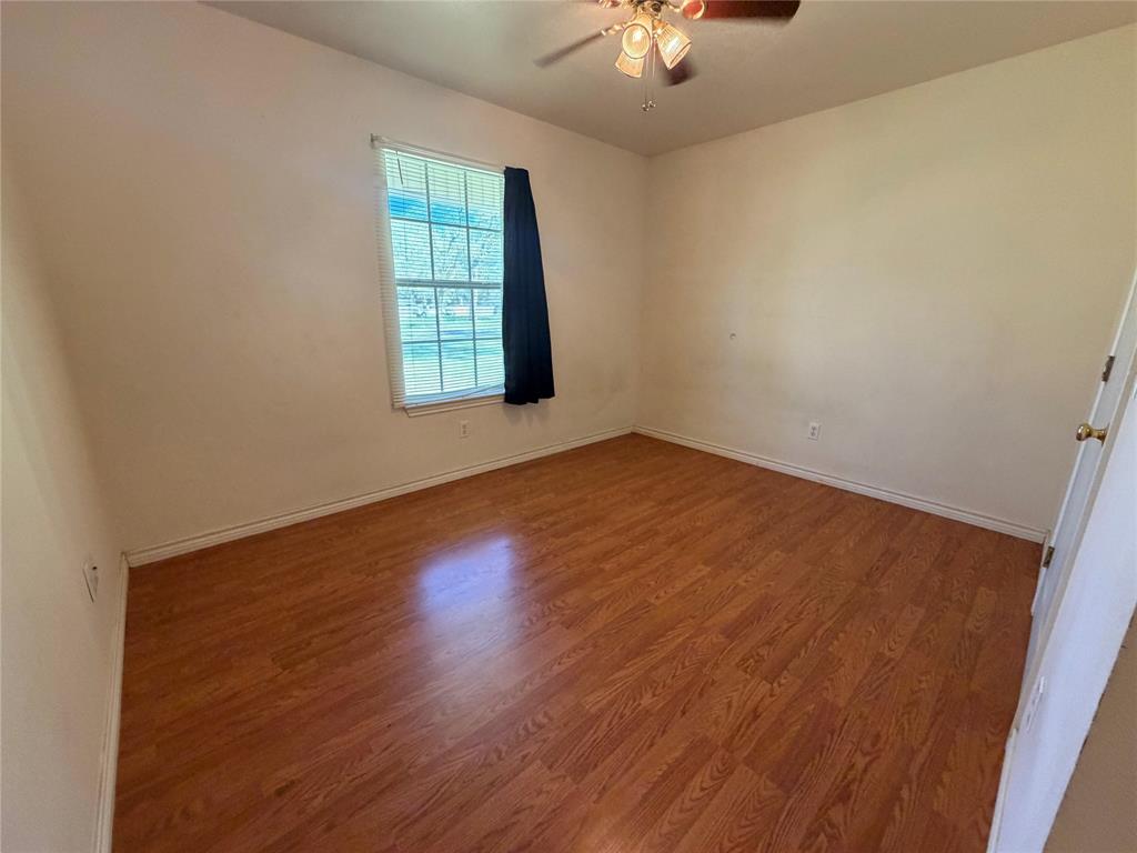 2502 Davisville Road Lufkin, TX 75901 - Photo 25 of 30 wooden floor in an empty room with a window